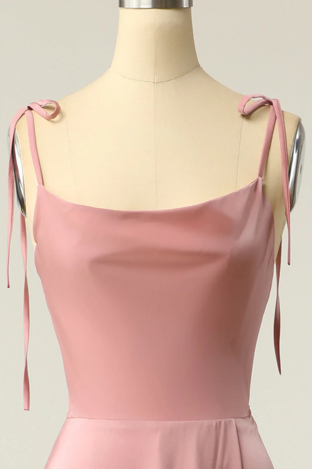 Side profile of the elegant V-neck spaghetti strap prom dress.