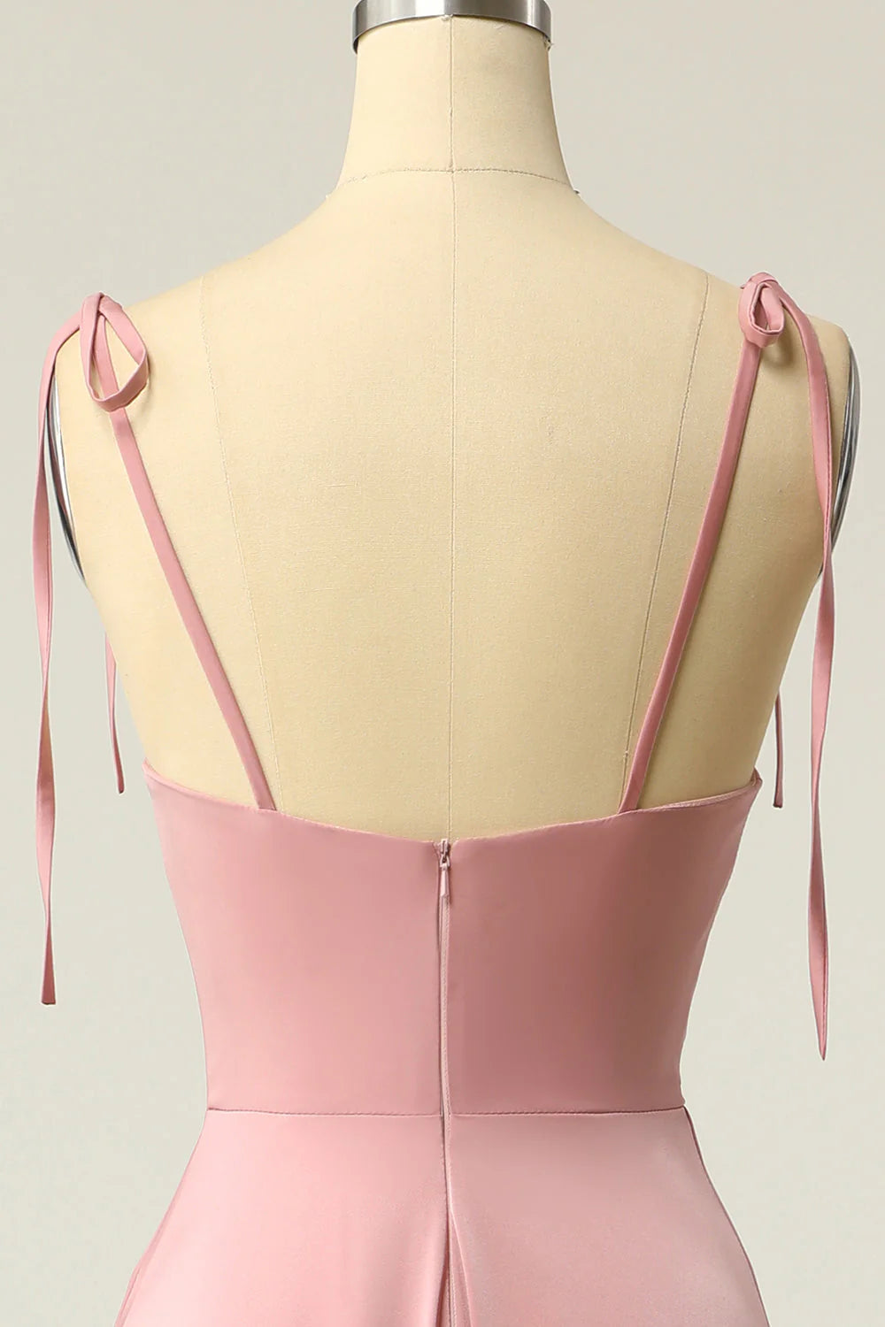 Close-up of the V-neckline and spaghetti straps of the formal prom dress.