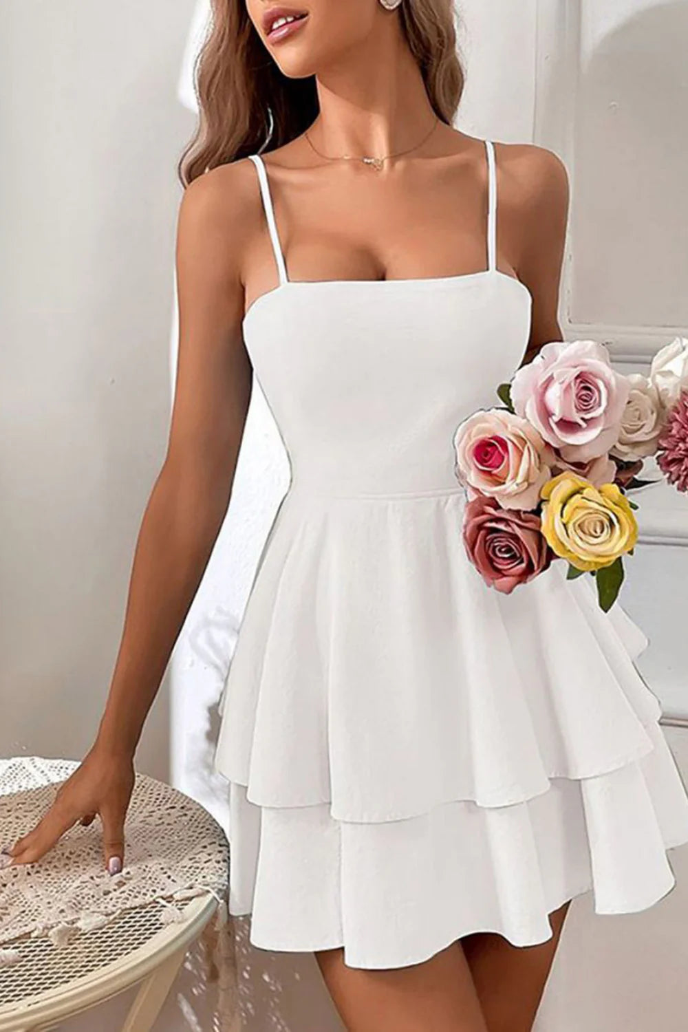 Woman in elegant V-neck spaghetti strap sheath evening dress.