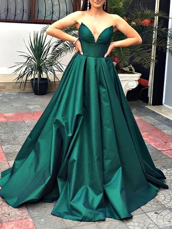 Woman wearing a V-neck strapless satin long prom dress.