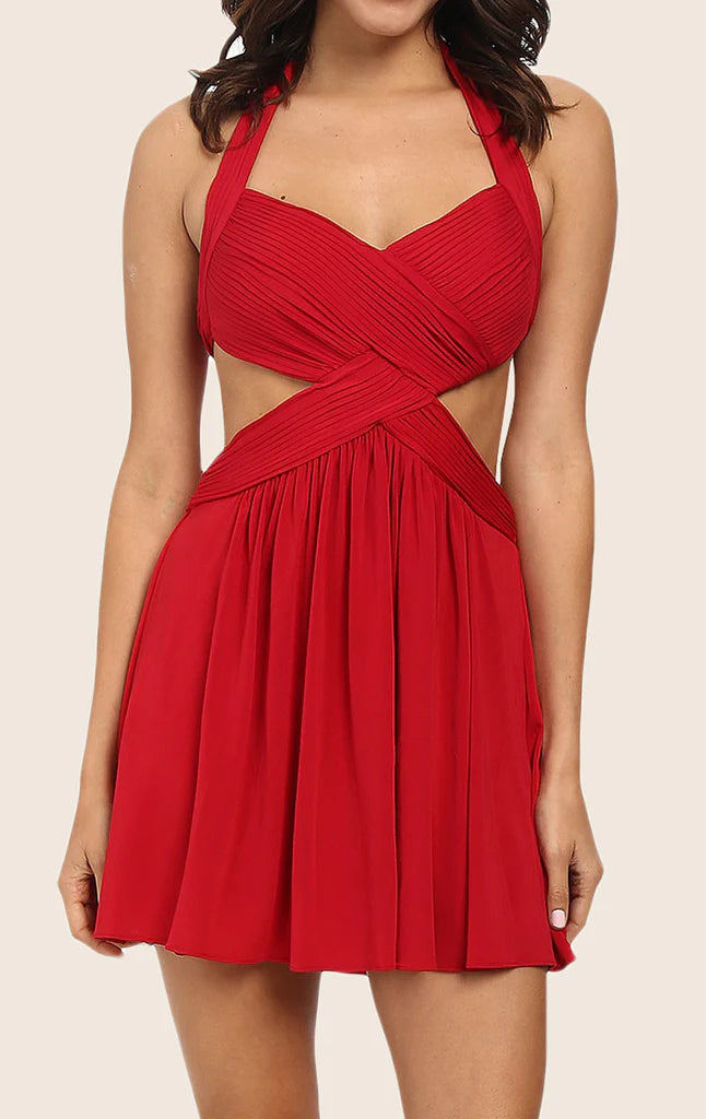 Woman wearing an elegant V-neck strappy sheath dress in a formal setting.