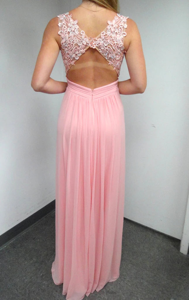 Elegant formal gown with V-neckline and flowing chiffon skirt.