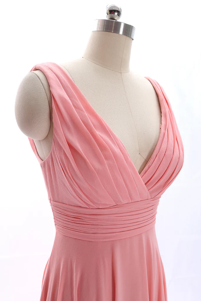 Side profile of a woman wearing the peach chiffon prom dress, showcasing its graceful drape.