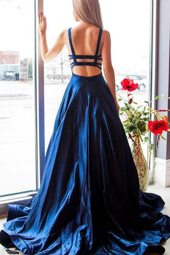 Side profile of a woman in the V-neck spaghetti strap prom dress.