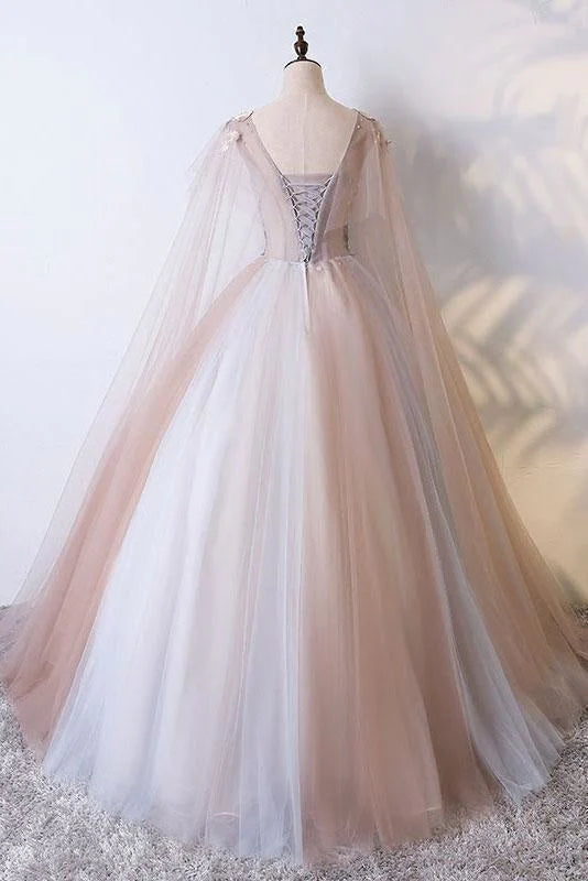 Floor-length quinceanera dress with V-neck and tulle appliques.