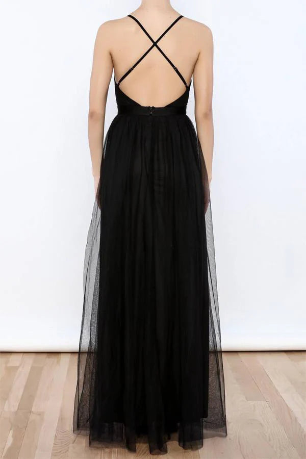 Back view of the elegant V-neck tulle evening gown with a flowing skirt.