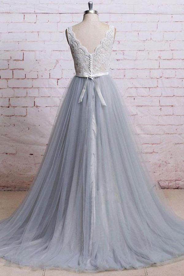 Back view of the V-neck prom dress, highlighting the tulle train and lace details.