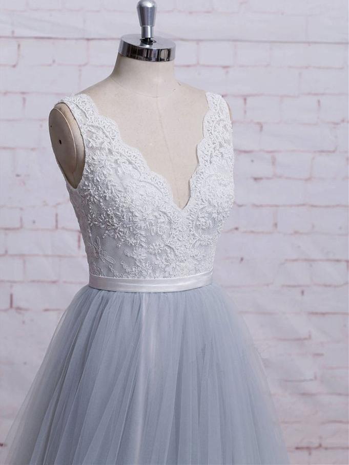 Close-up of the lace bodice and V-neckline on the elegant prom gown.