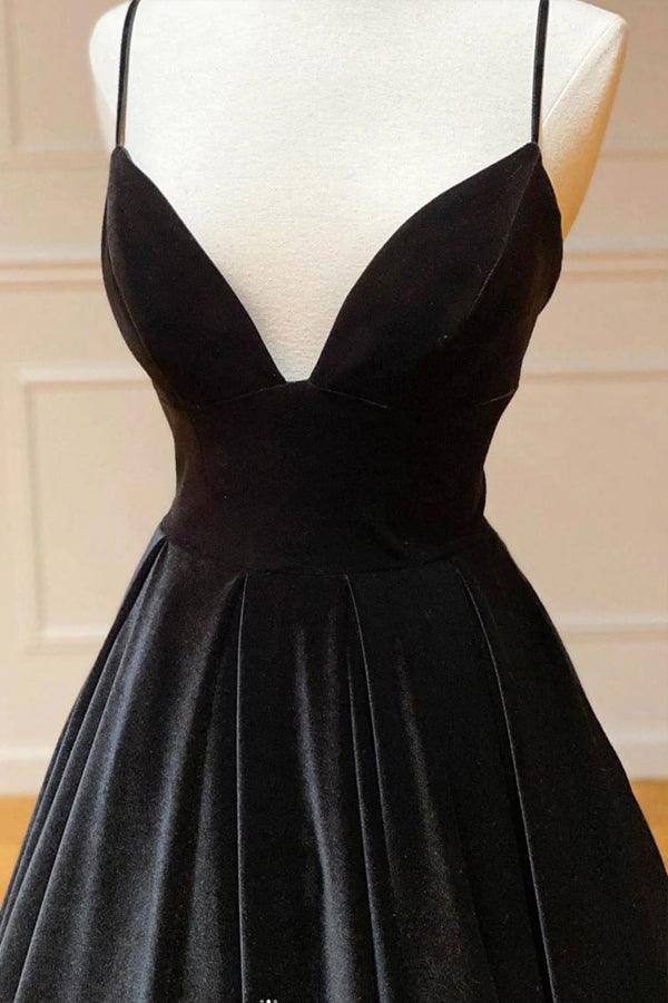 Woman showcasing a sophisticated velvet formal dress.