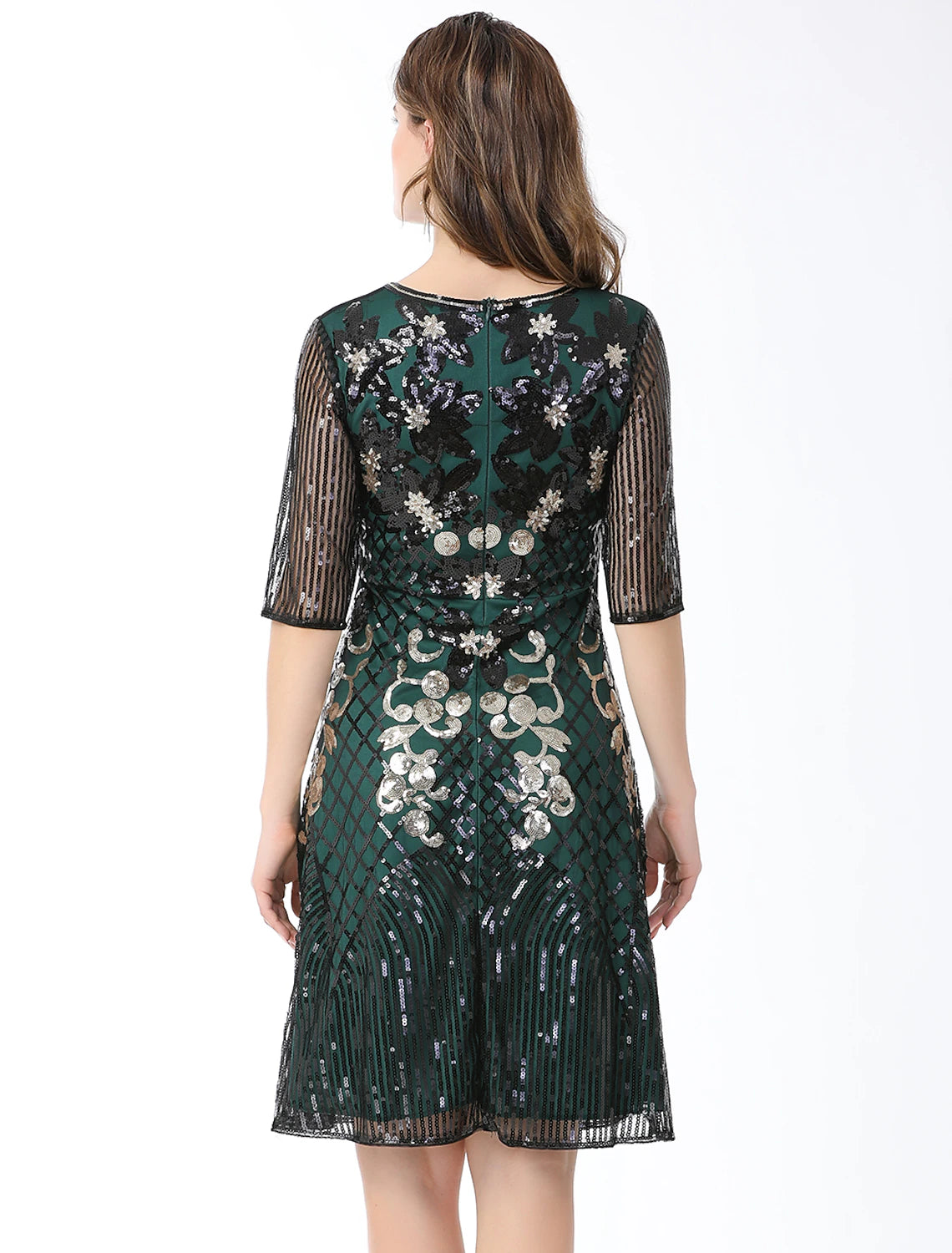 Detail of the cotton blend fabric and sequin embellishments on the dress.