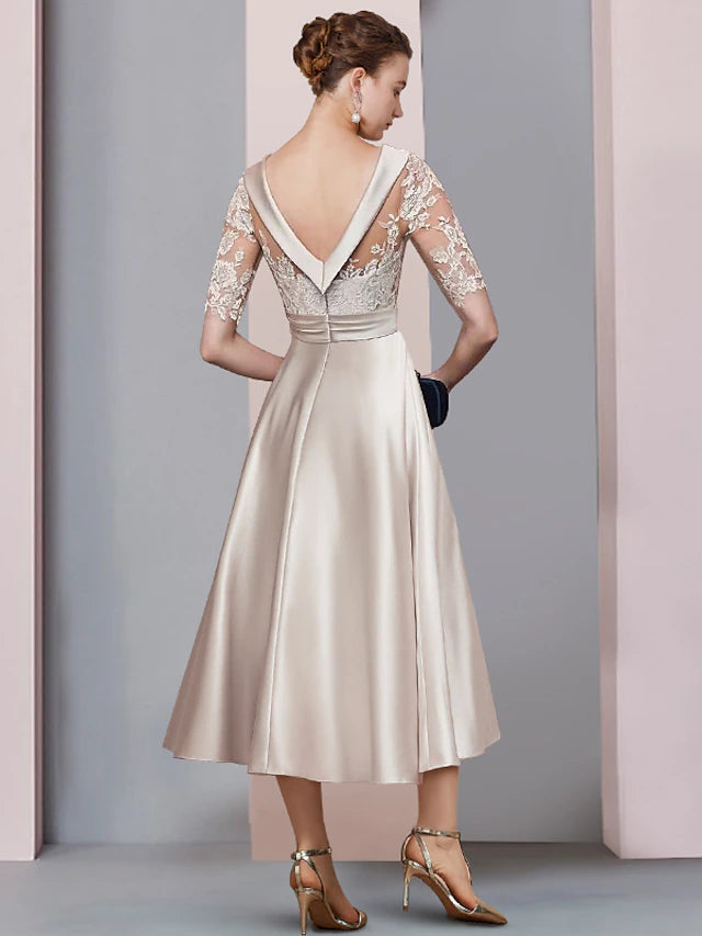 Back view of the A-Line tea length dress, showing satin and lace details.