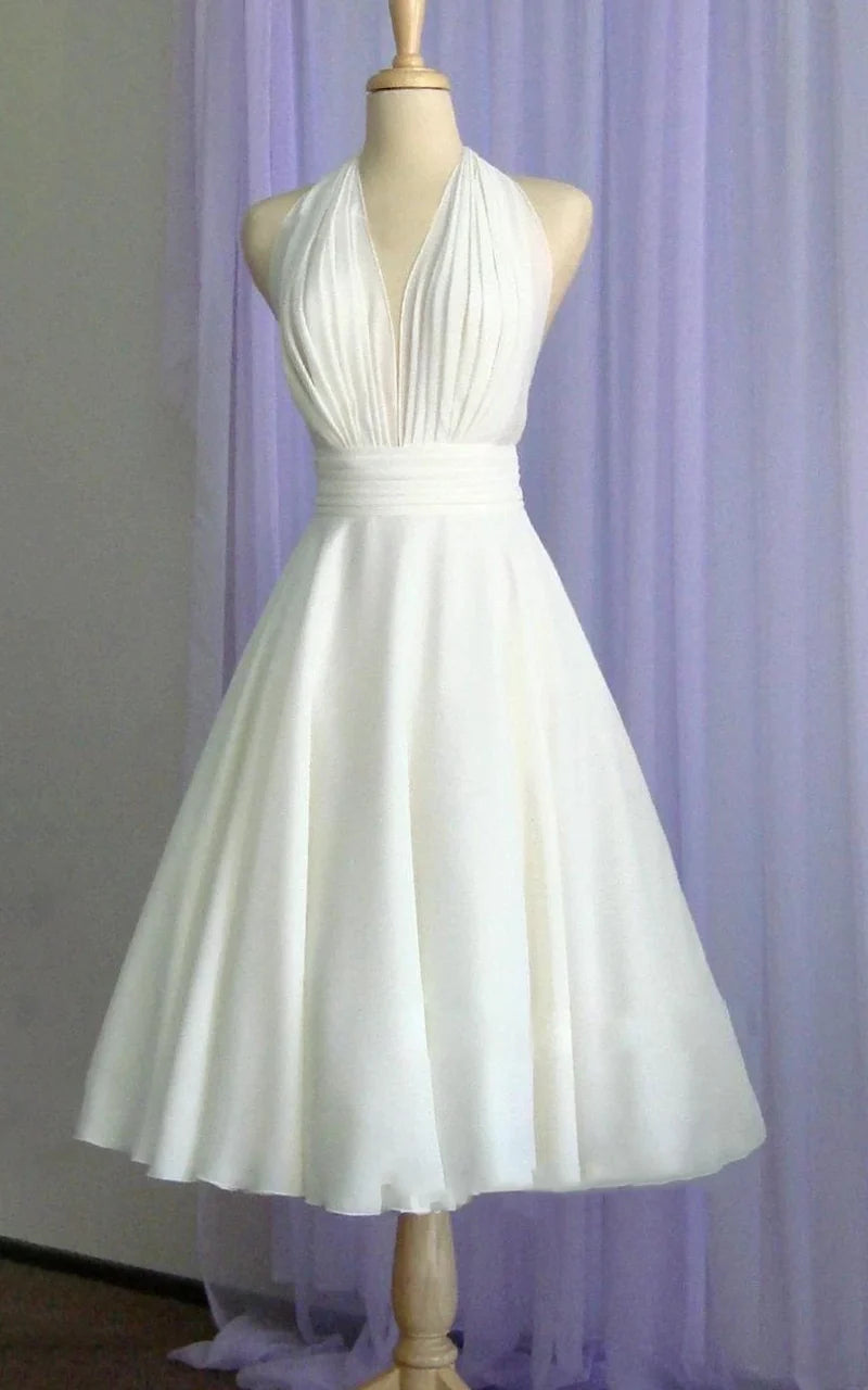 Elegant A-line halter neck tea-length chiffon wedding dress.