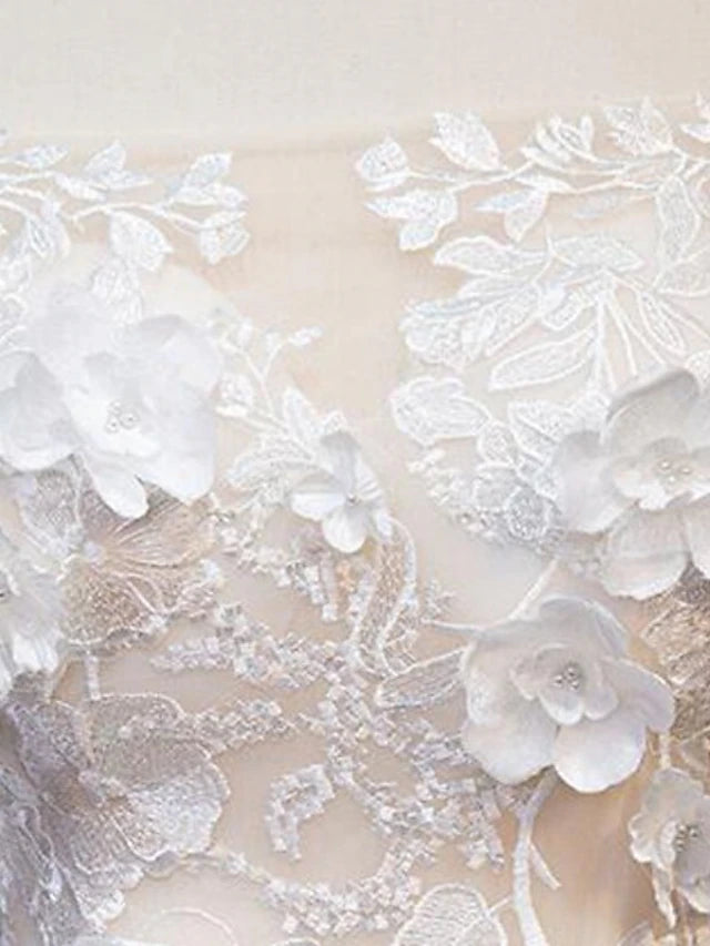 Side profile of a bride in a vintage off-shoulder cap sleeve wedding gown.
