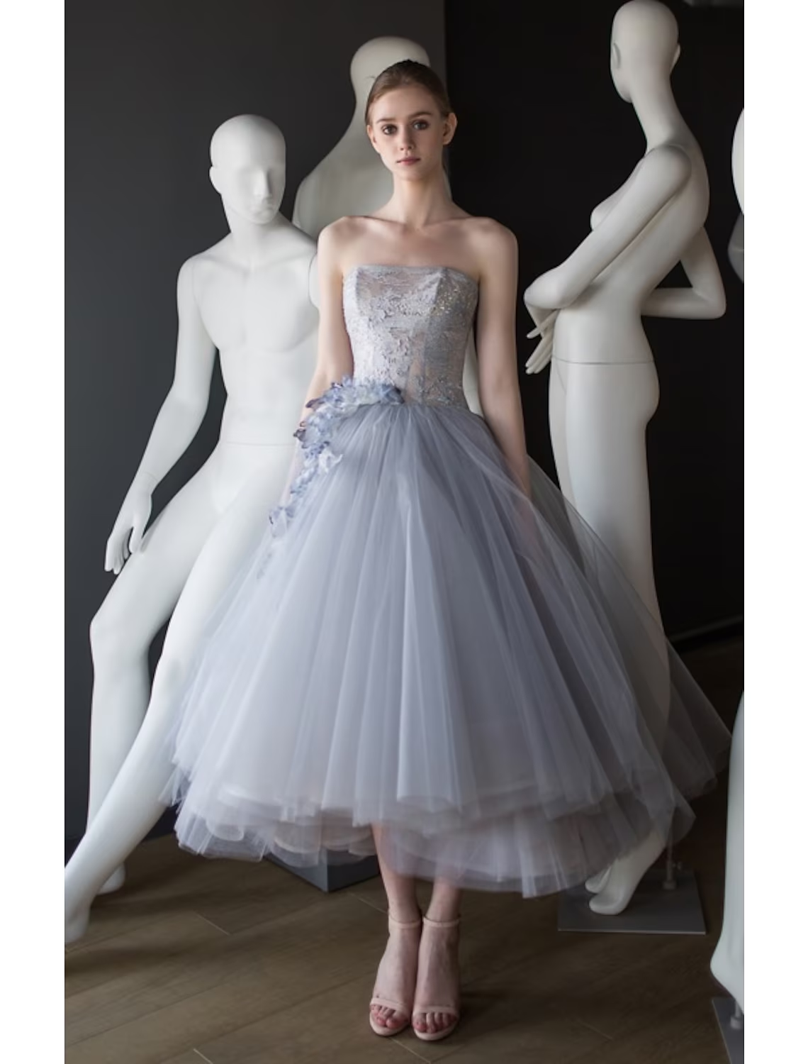Elegant strapless tea length ball gown with appliques.