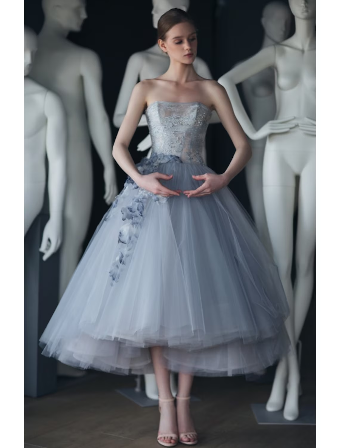 Vintage tulle prom dress with tiered skirt detail.