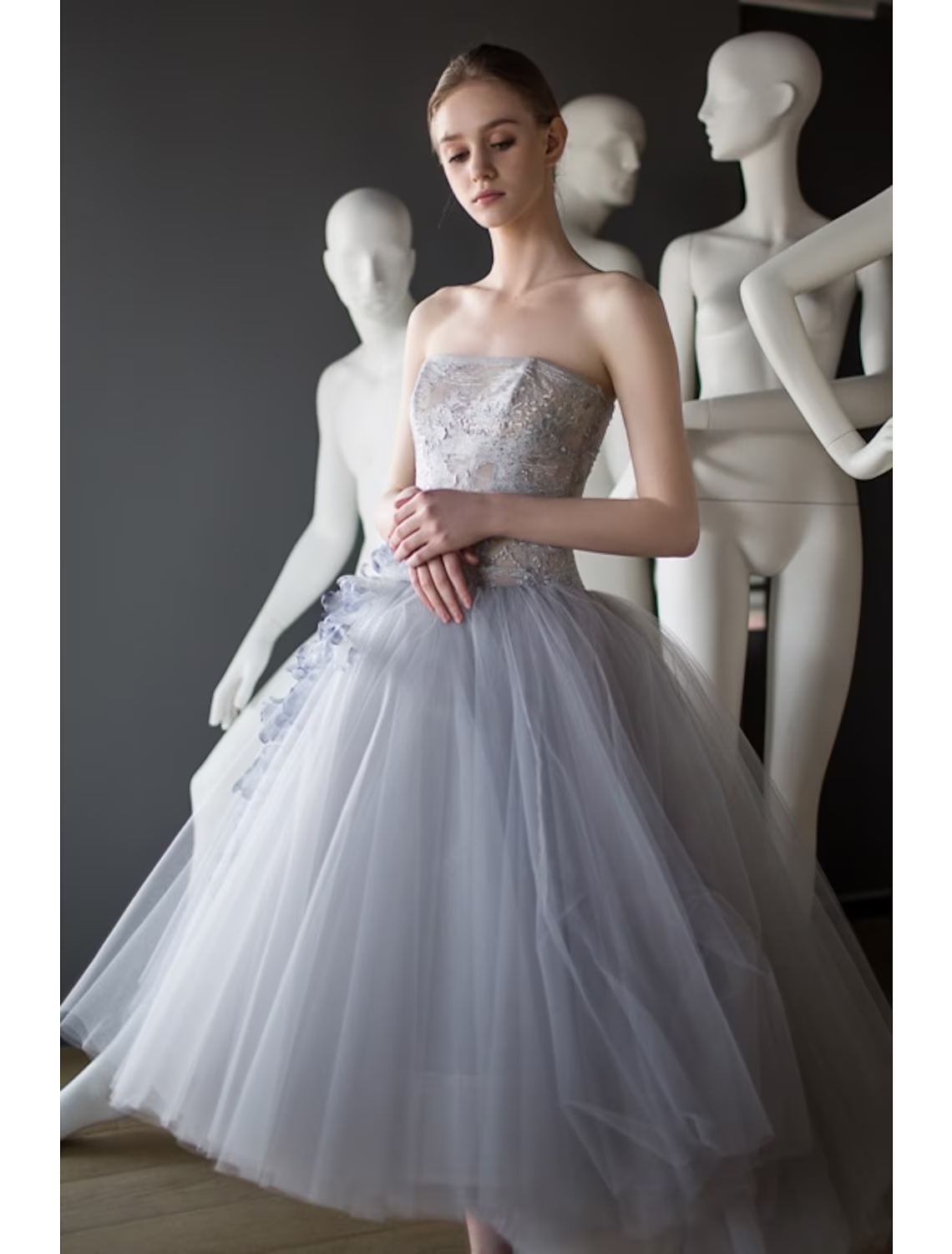 Close-up of appliques on a tiered tulle ball gown.