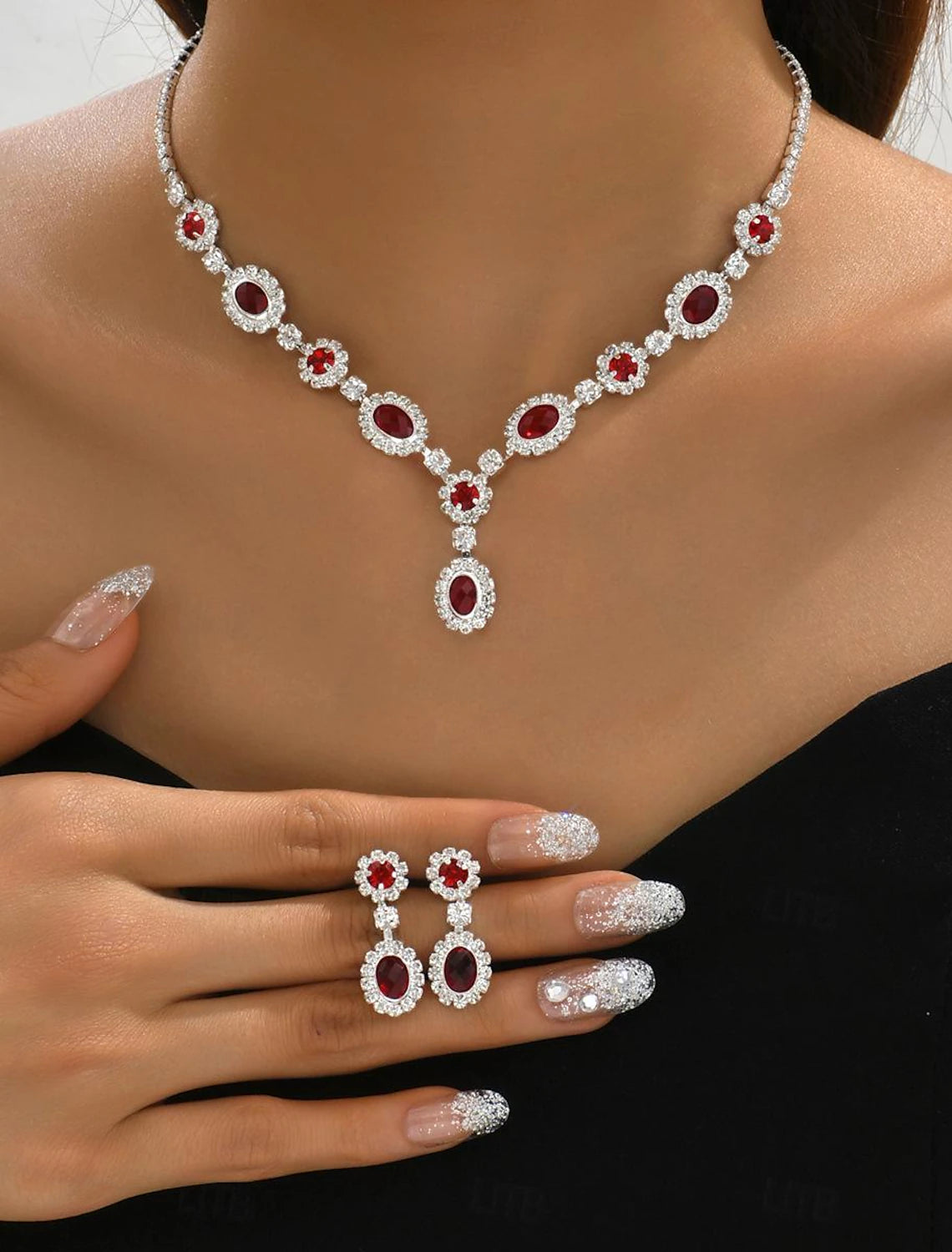 Woman wearing an elegant 3-piece rhinestone alloy geometric jewelry set, including a necklace and matching earrings.