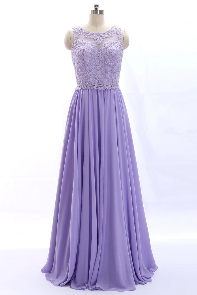 Elegant vintage lace and chiffon prom gown with spaghetti straps.