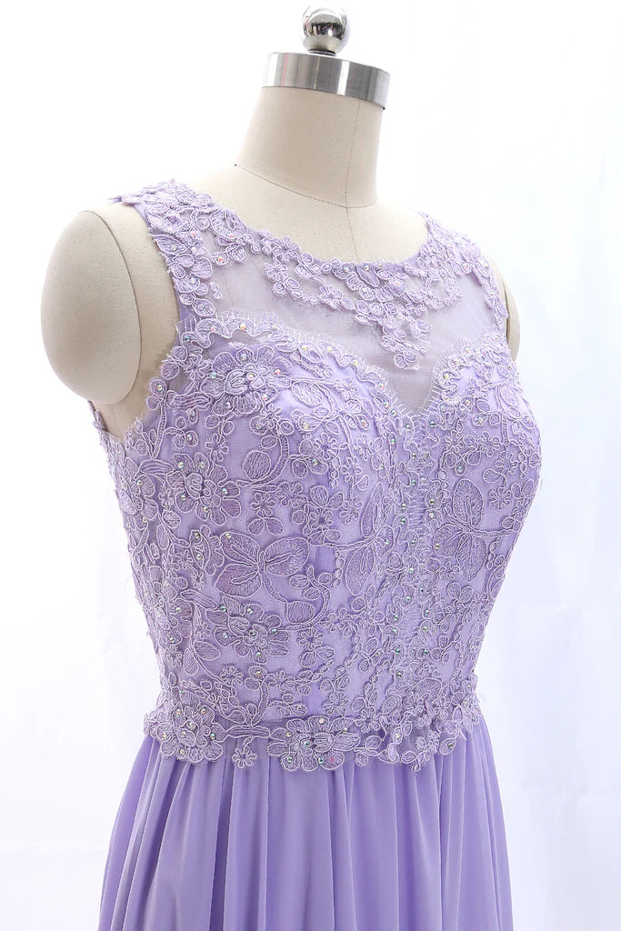 Close-up of the lace bodice and flowing chiffon skirt on a formal gown.