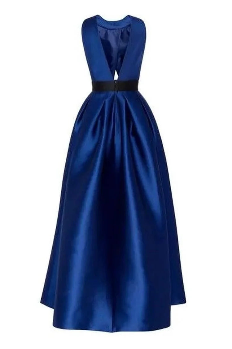 Back view of a woman in a sleeveless pleated halter prom dress.