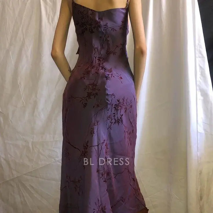 Back view of purple vintage print formal dress with ruffled details.