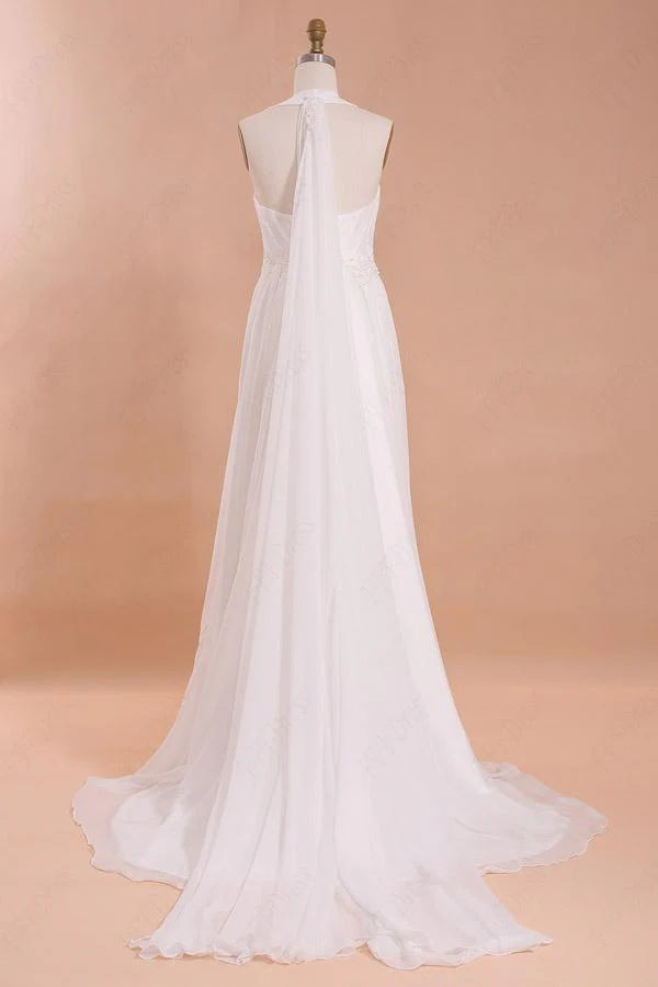 Elegant floor-length halter wedding gown on a bride.