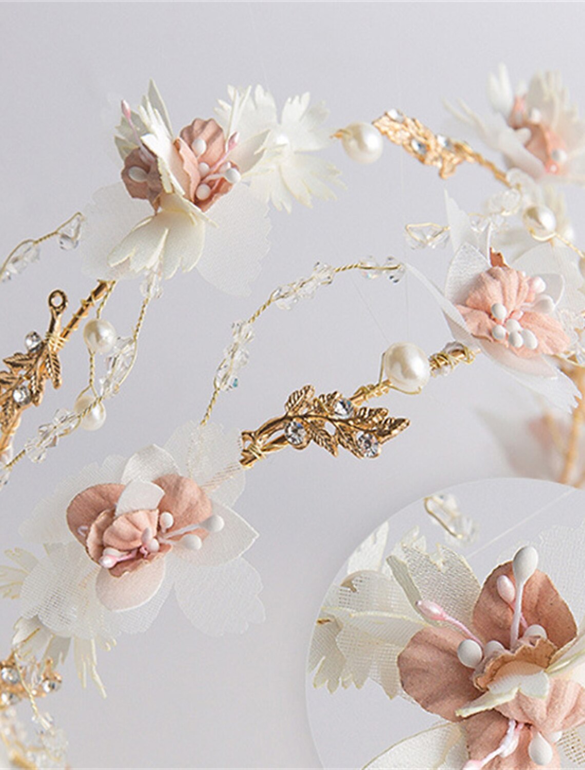 Close-up of white floral hairpins with intricate details.