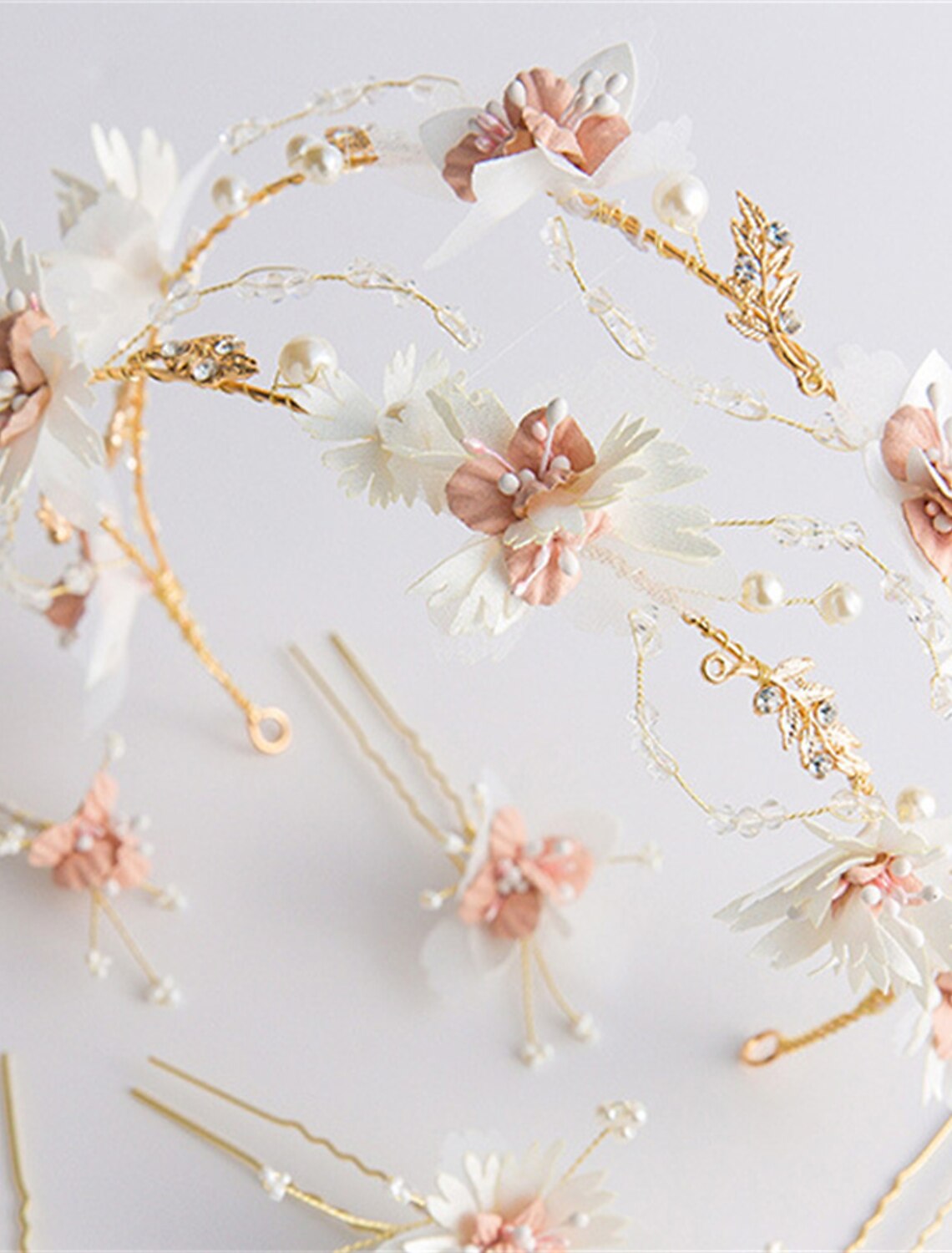 Back view of a model wearing the white floral crown headband.