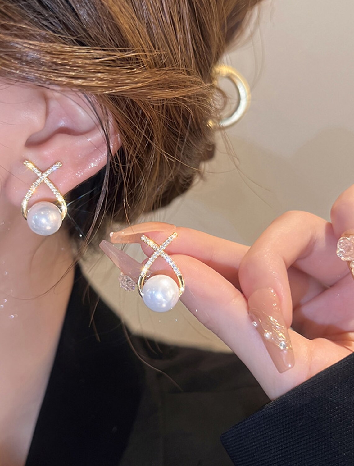 White imitation pearl stud earrings in a gift box.