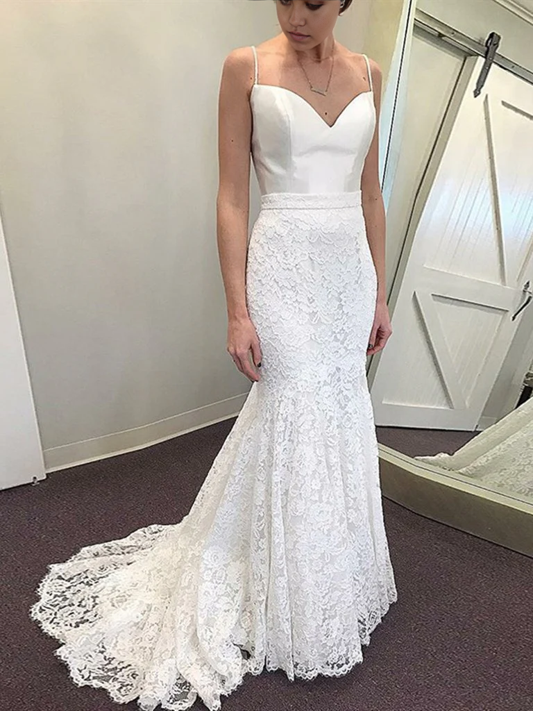 White mermaid lace wedding dress with spaghetti straps and sweep train.