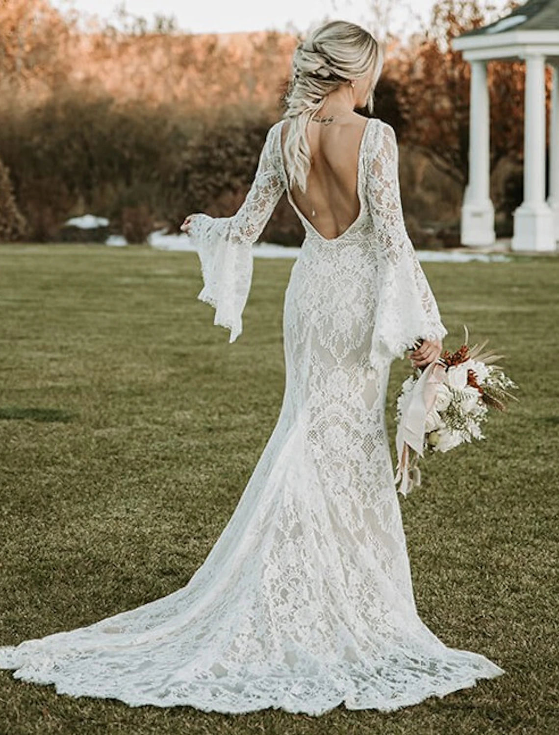 Back view of the mermaid wedding dress, showcasing the court train and lace details.
