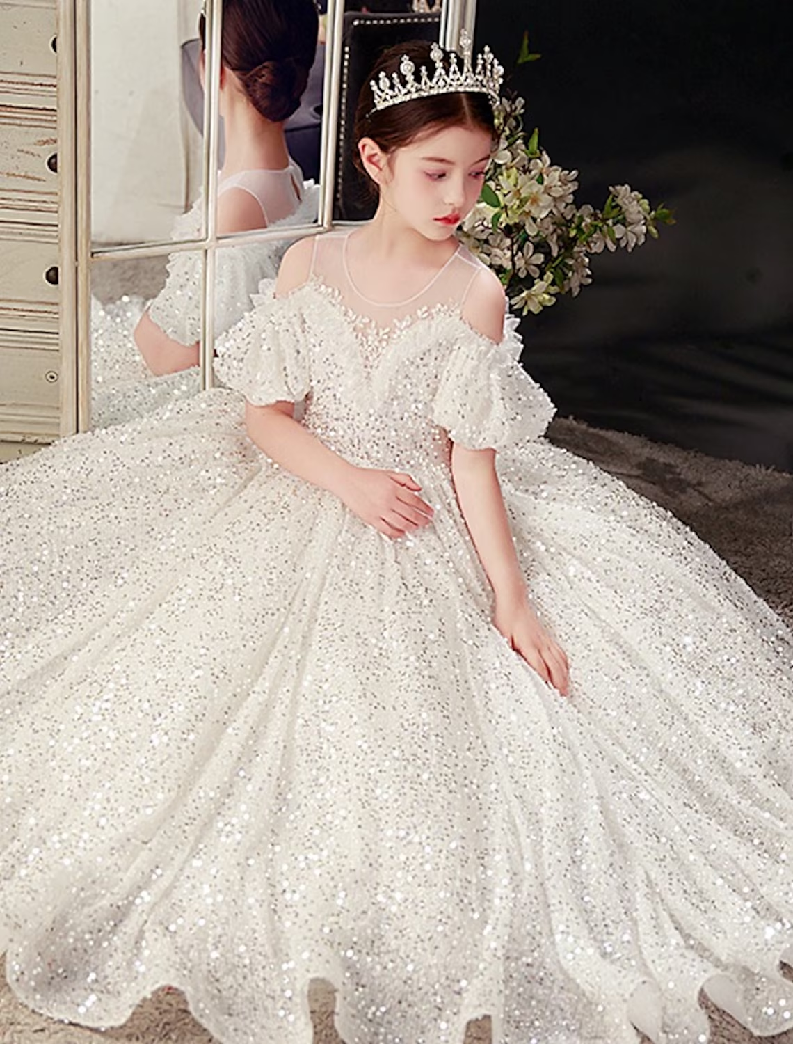 Close-up of the mesh and tulle fabric on the white girls' dress.