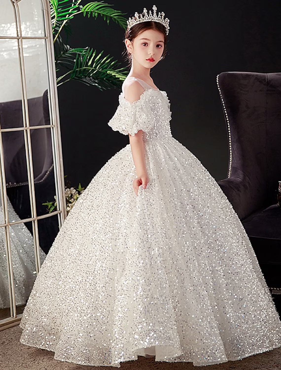 Back view of the elegant white princess dress with short sleeves.