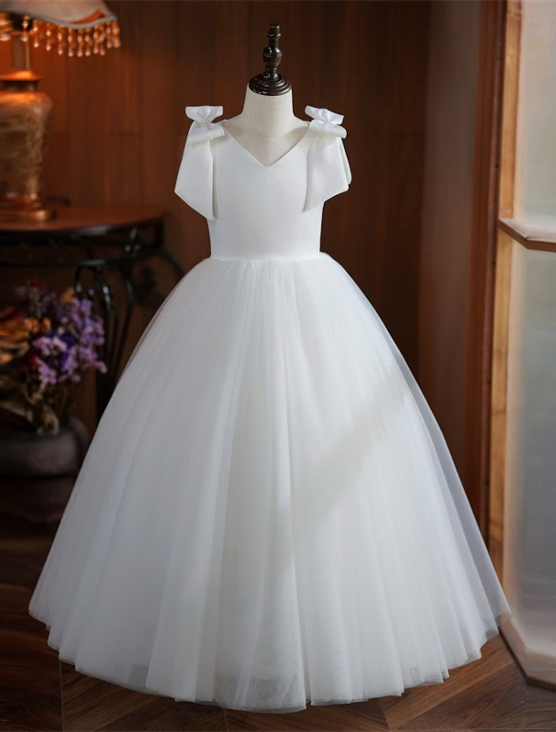 White sleeveless First Communion dress for girls, front view.