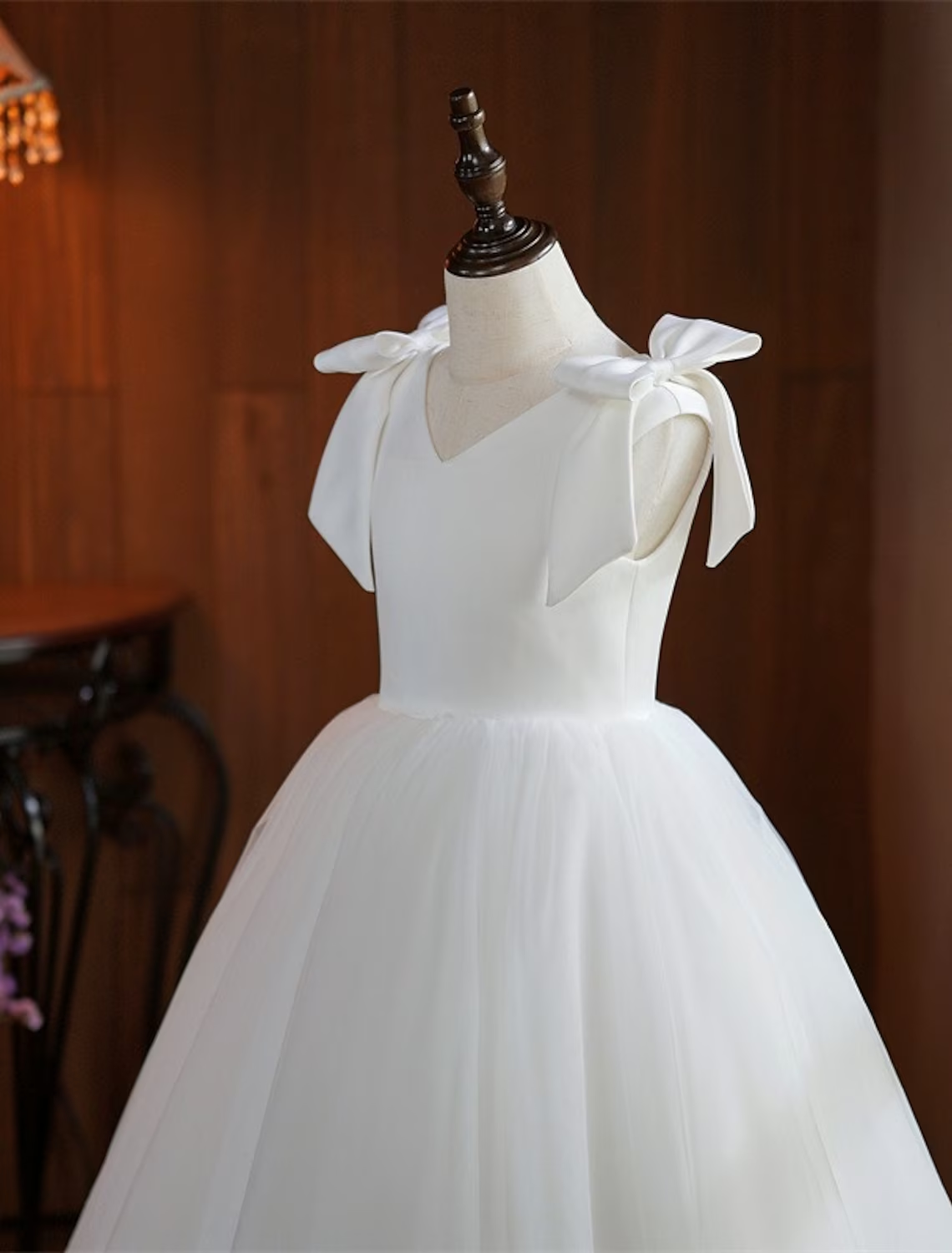 Close-up of the white mesh and tulle fabric on a girl's dress.