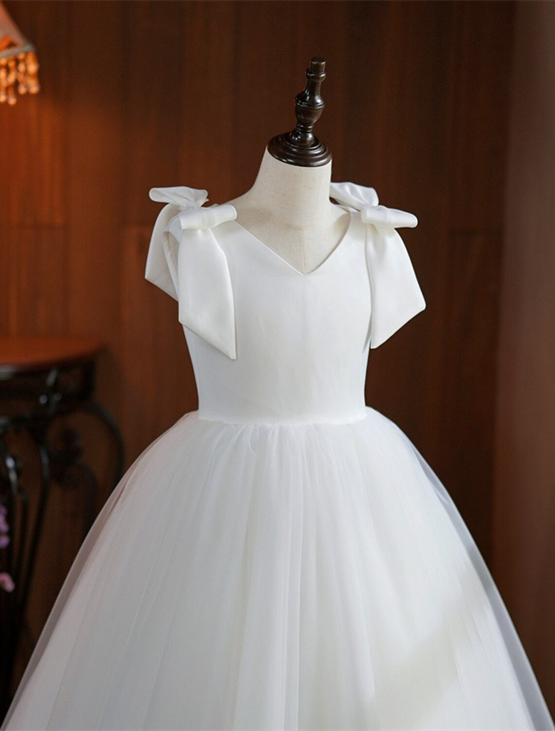 Back view of the white mid-calf First Communion dress.
