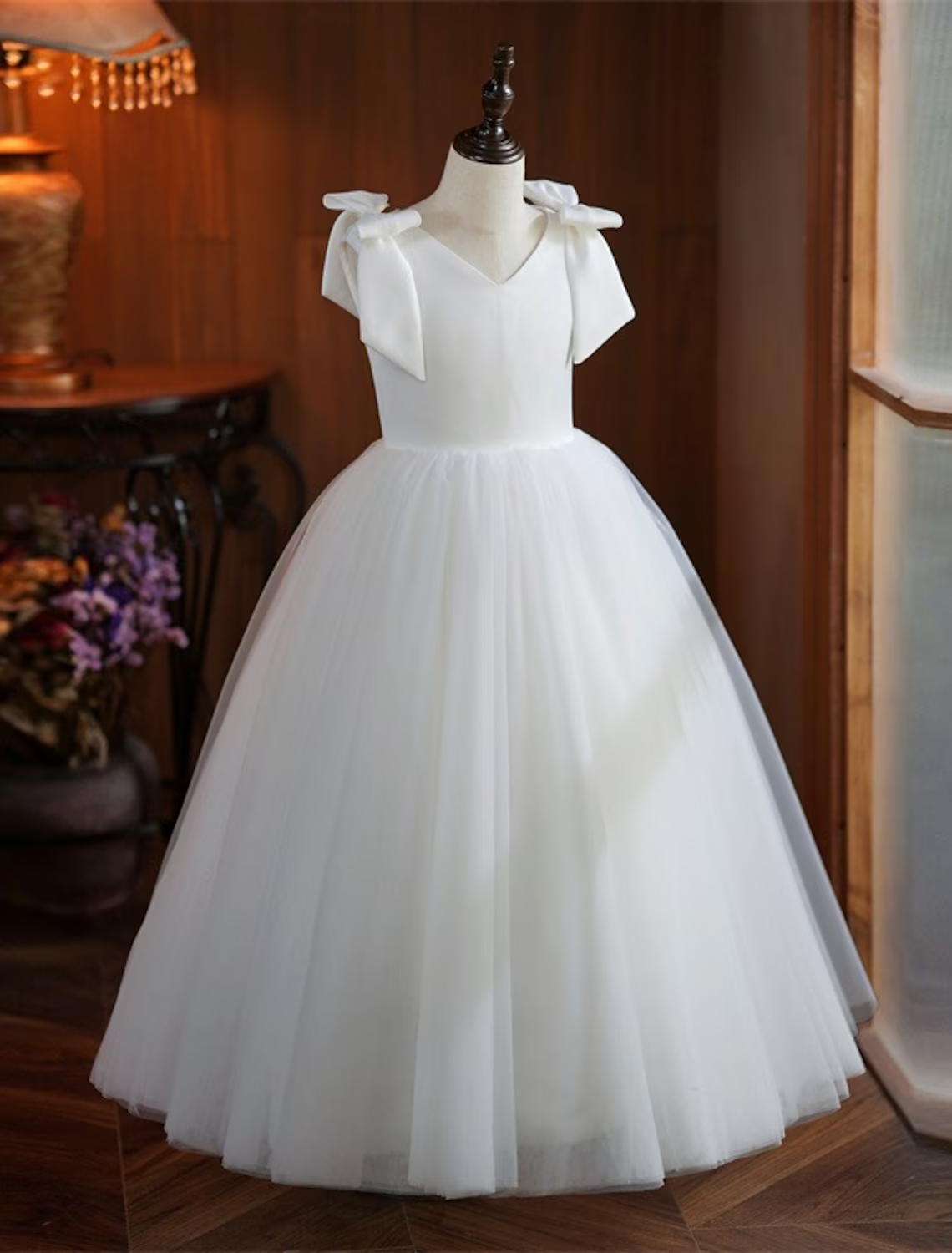 Detail of the white tulle skirt on a girl's formal dress.