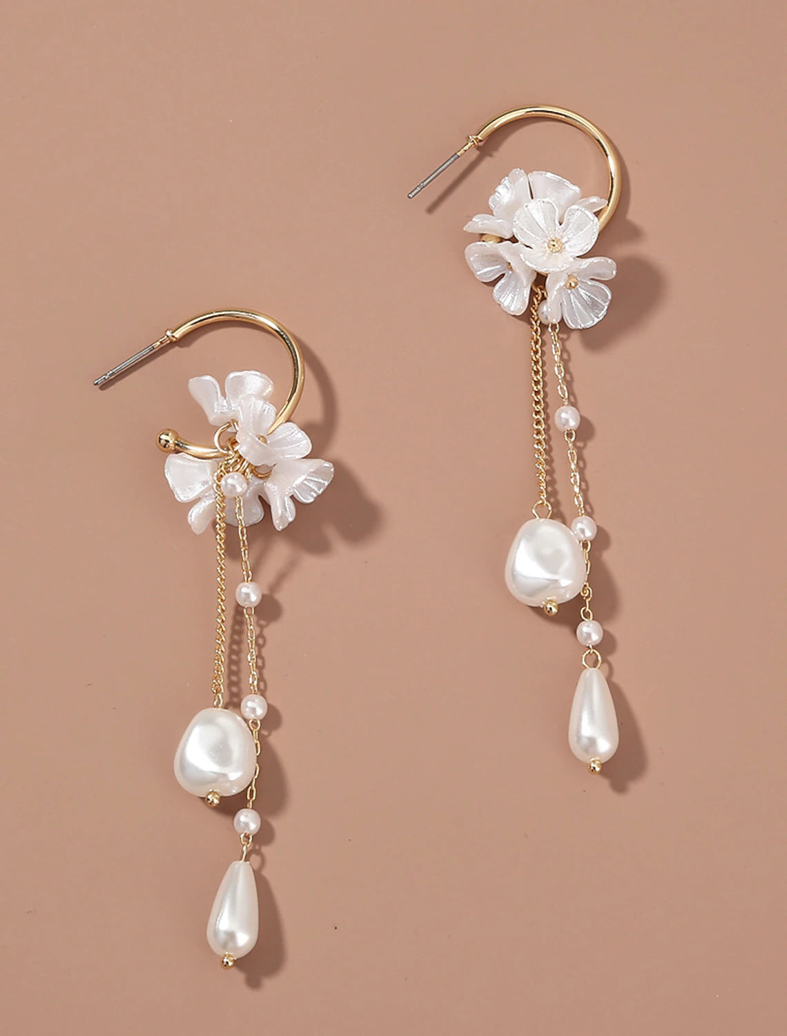 Pair of white tassel fringe flower earrings.