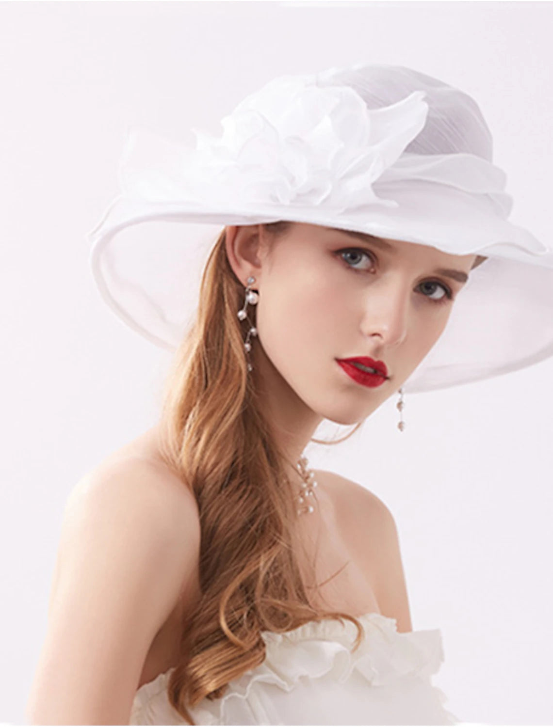 Back view of a woman wearing a decorative organza hat.