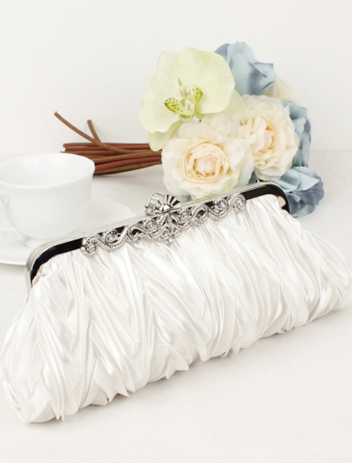 Elegant women's clutch bag with crystal rhinestones, front view.