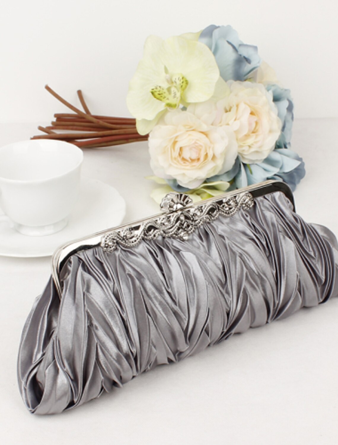 Sophisticated women's clutch bag, side view, showcasing texture.