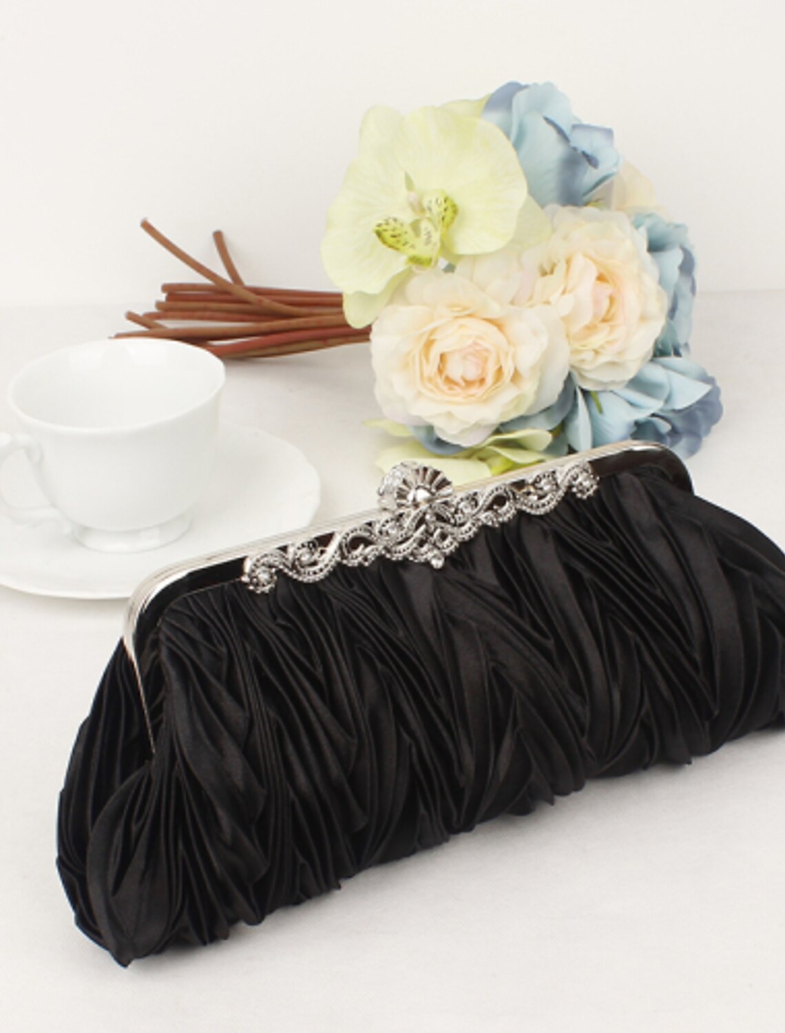 Women's evening clutch bag, open, revealing interior.
