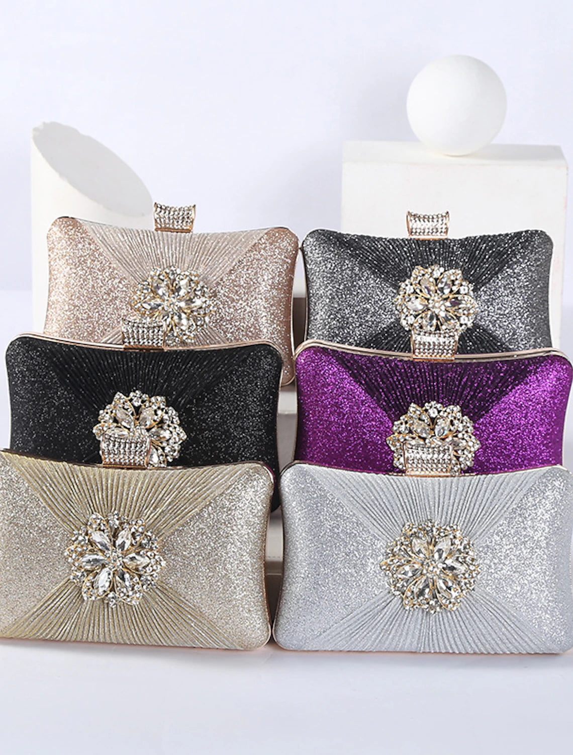 Close-up of the rhinestone crystal detail on the clutch bag.
