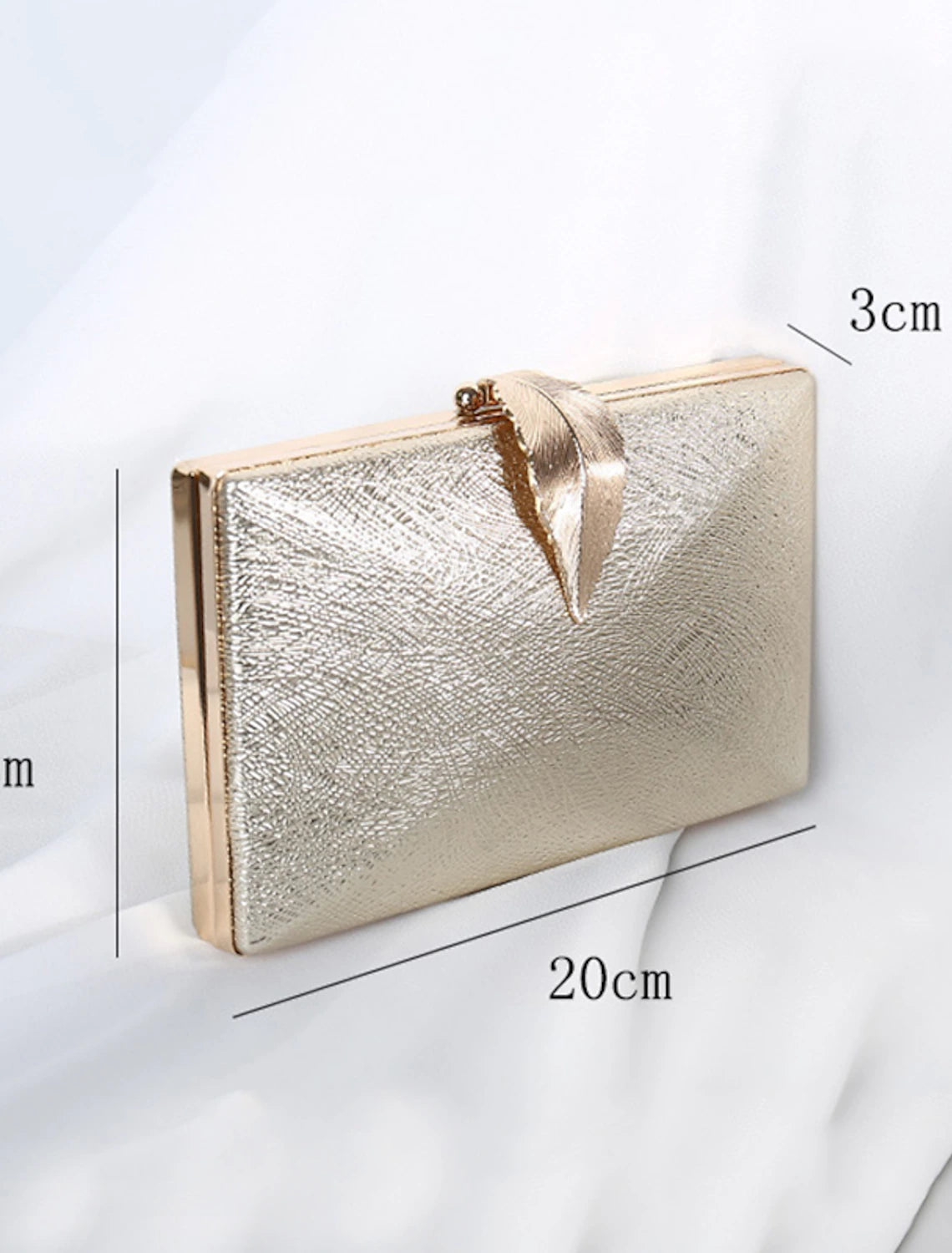 View of the clutch bag from the side, emphasizing its slim profile.