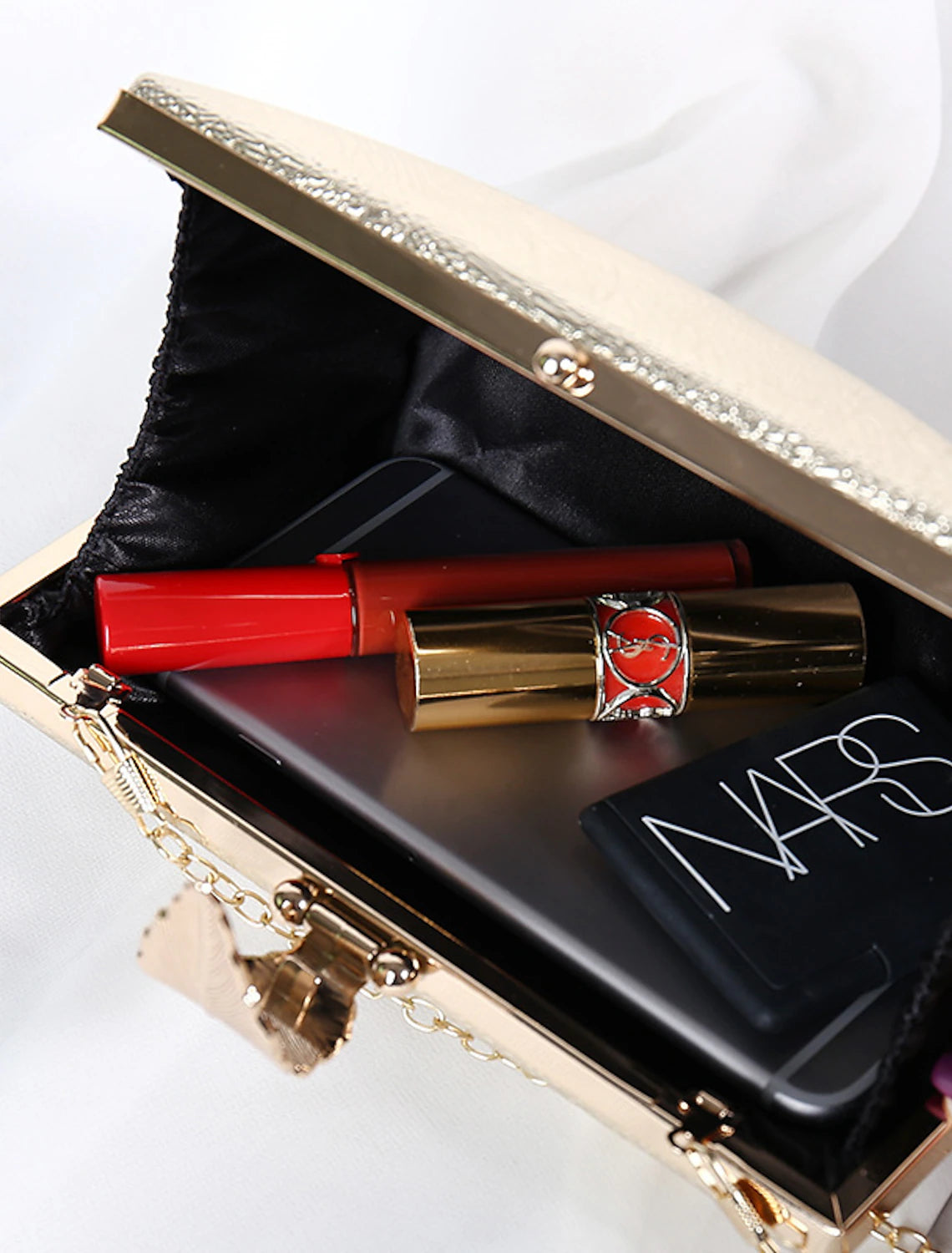 Solid polyester clutch bag, ready for an elegant evening out.