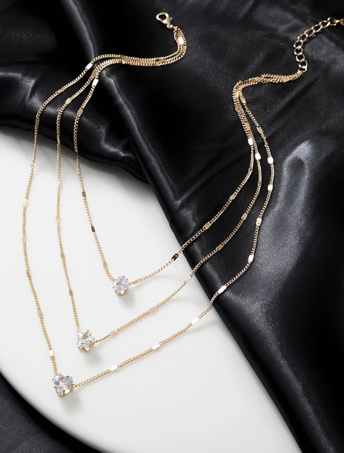 Detailed view of the geometric pattern on the Zircon Chrome necklace.