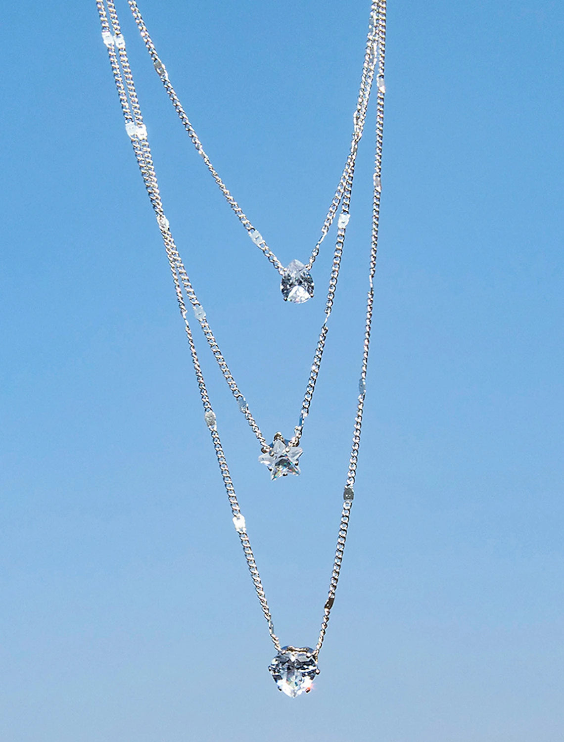 Side view of the Zircon Chrome geometric necklace.