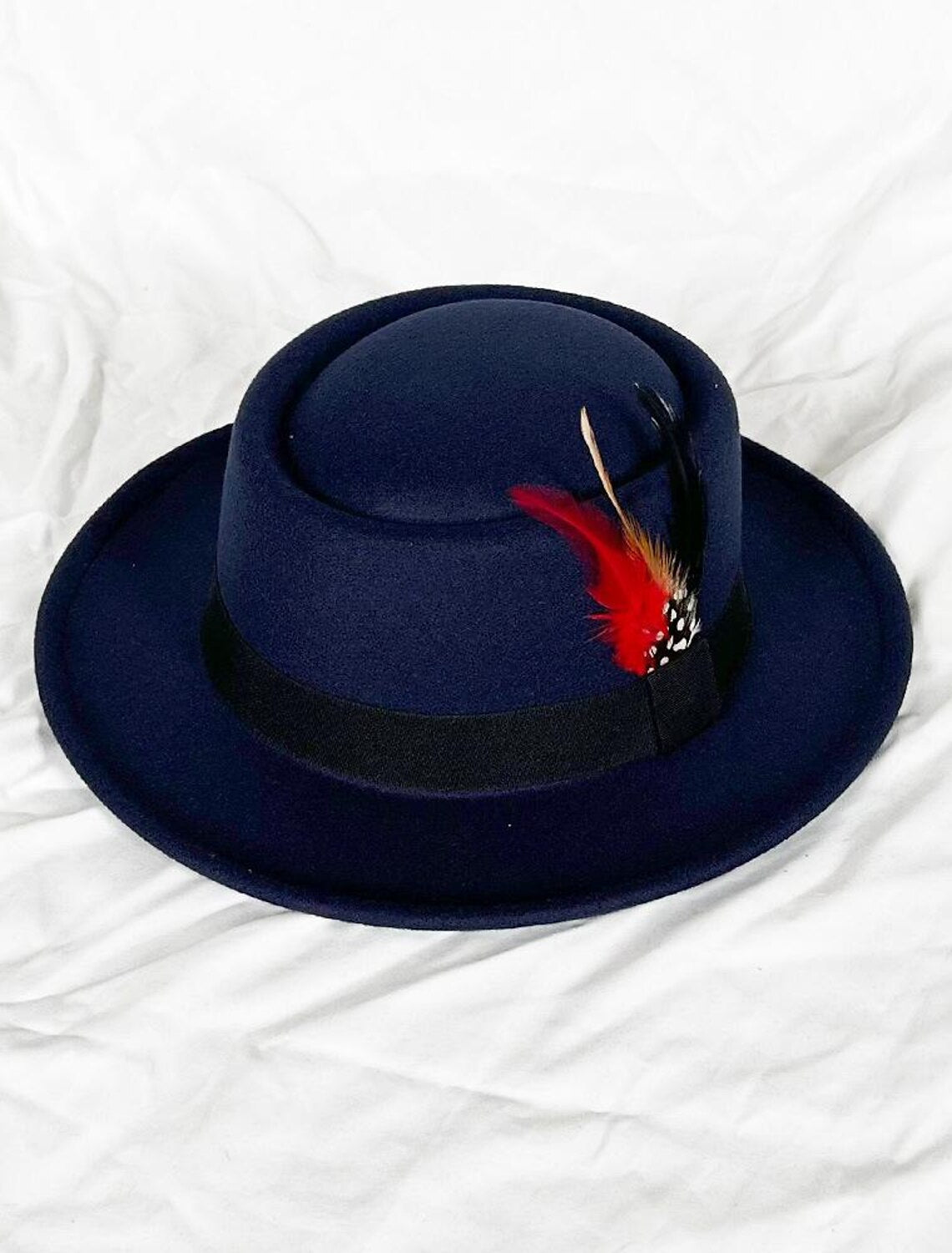 Side view of a formal fedora hat in wool acrylic.