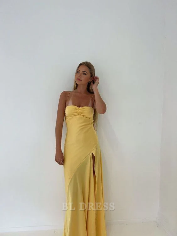 Back view of a yellow mermaid evening gown with spaghetti straps.