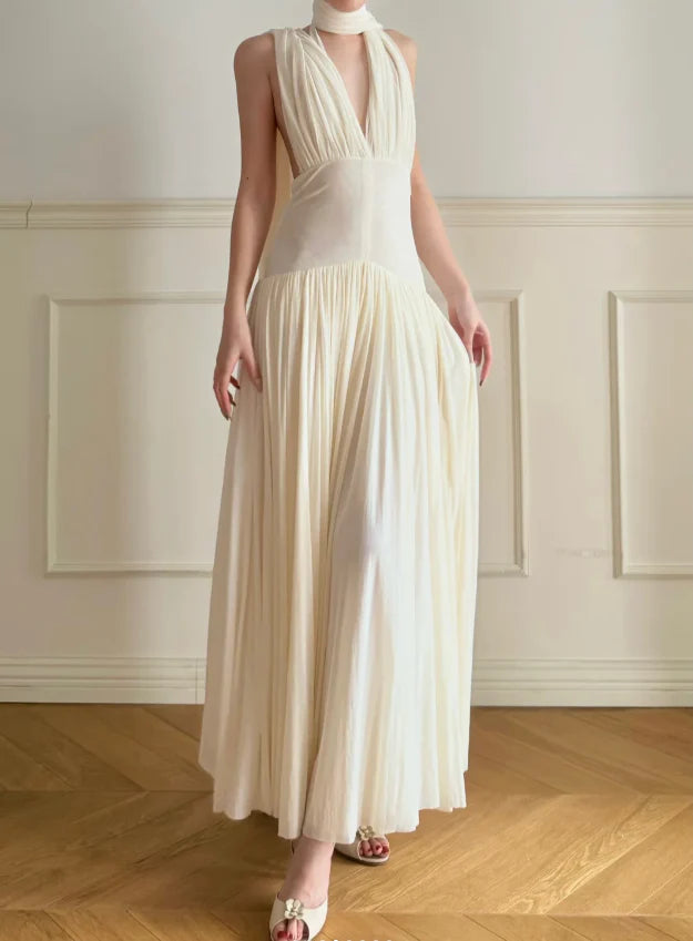 Elegant Cream Halter Neck Prom Dress With Deep V Neck Open Back And Flowy Maxi Skirt For Formal Evening Party
